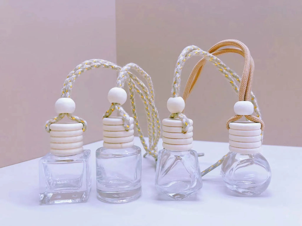 Glass car fragrance pendant showing Cylinder, Diamond, Flat Drum, and Square bottle style options.