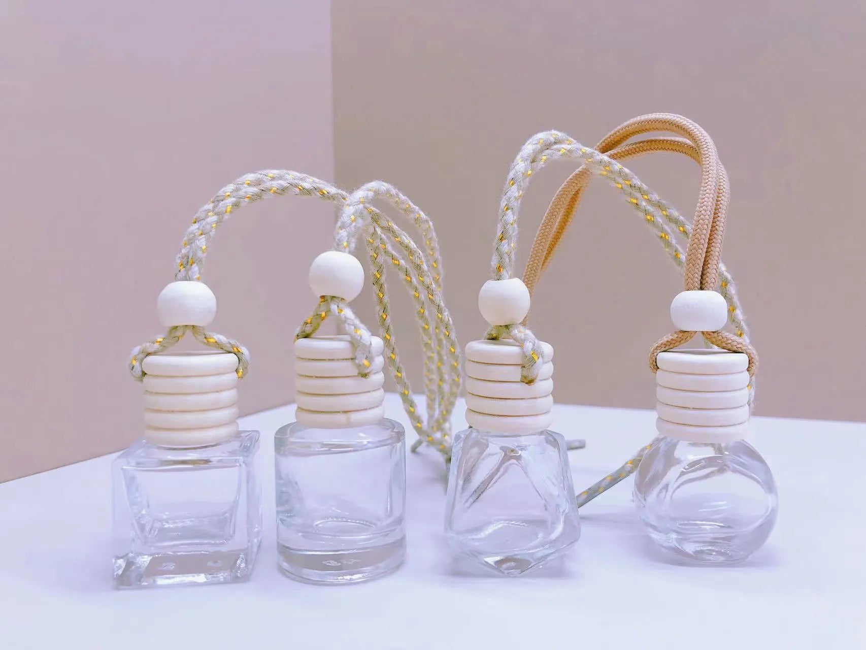 Glass car fragrance pendant showing Cylinder, Diamond, Flat Drum, and Square bottle style options.