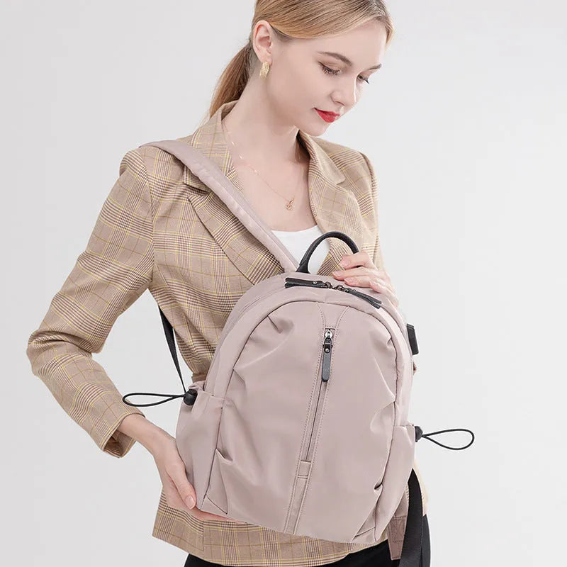 Women's Oxford cloth travel backpack with A4 and 14 inch sizes, multi-pocket interior, and sandwich pocket.