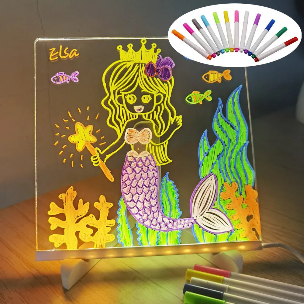DIY acrylic LED message board on a desk with handwritten notes, glowing softly, next to colourful pens.