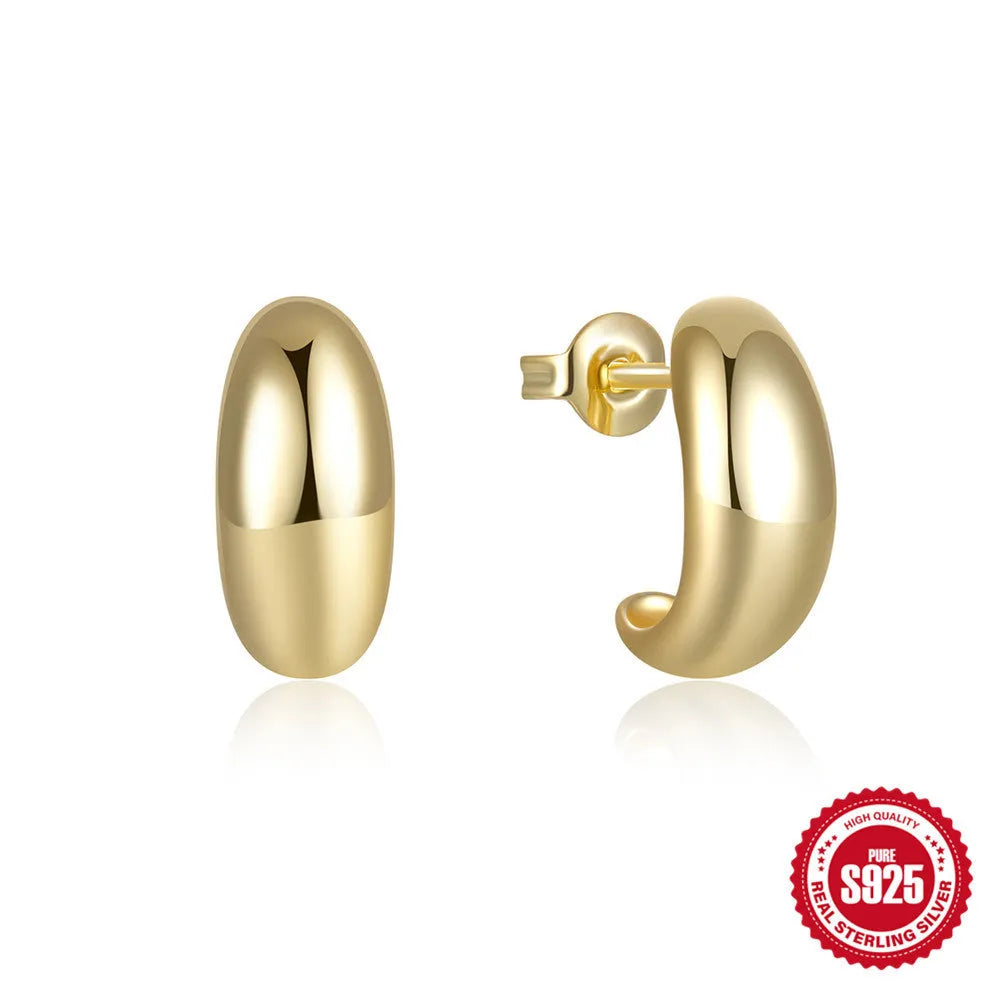 C-shaped sterling silver stud earrings with glossy electroplated finish in gold colour