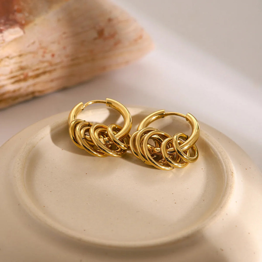 A pair of modern stainless steel earrings with an electroplated colour finish in a unisex ins style.