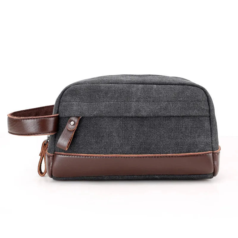 Men's canvas changing wallet in horizontal square shape with soft carry handle and zippered compartments, available in five solid colours.