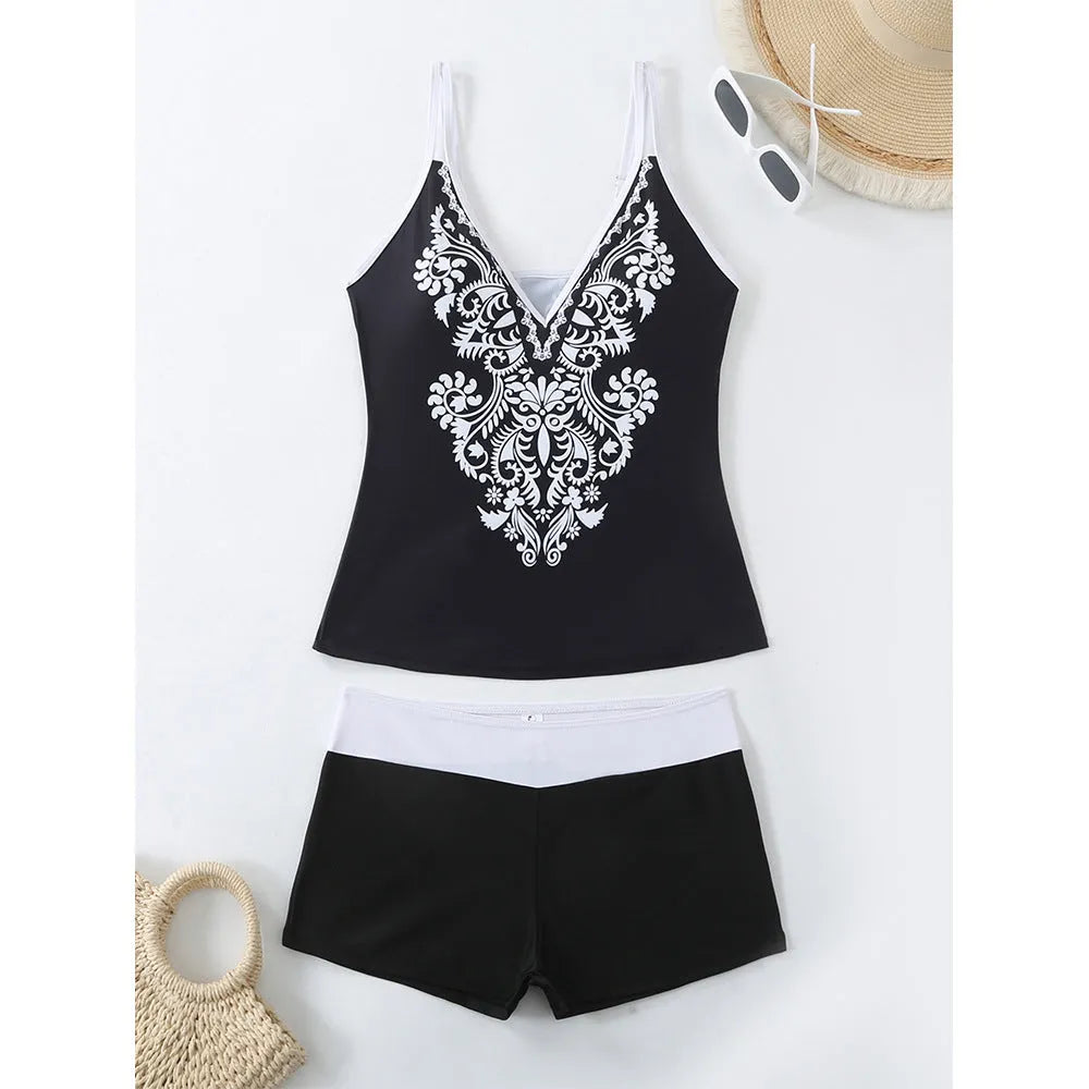 Plus size women's printed two-piece swimsuit in black or rose red with brief bottoms.