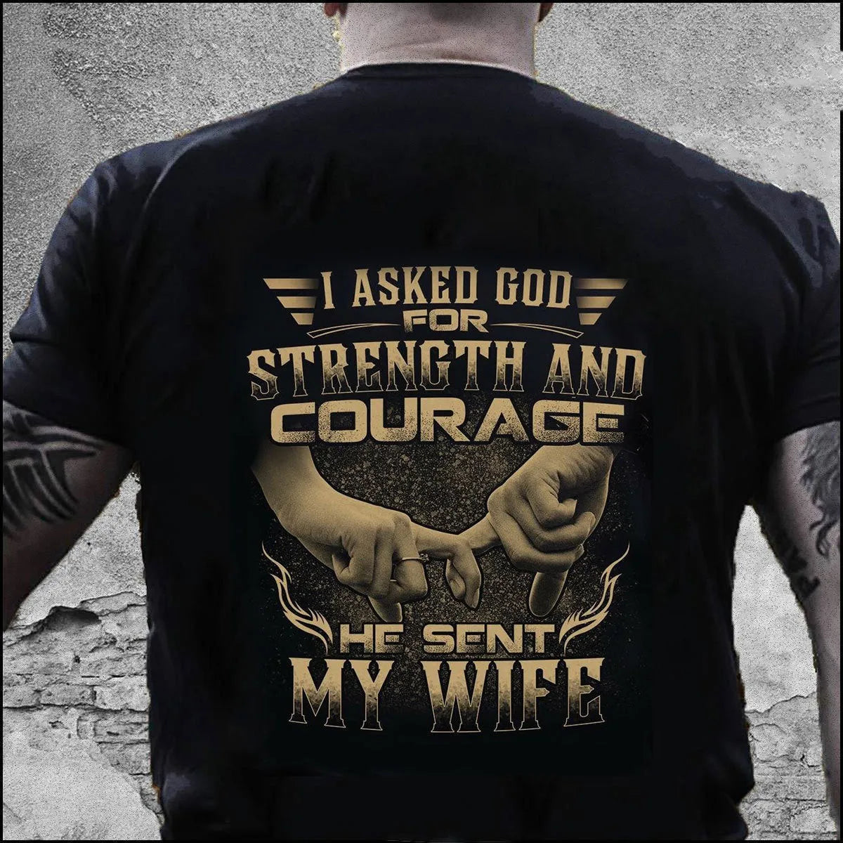 Mens black loose-fit polyester T-shirt with skull and slogan print on front, shown on model