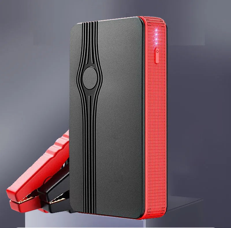 Red K4-E automobile emergency starting power supply unit with data cable, compact rectangular design.