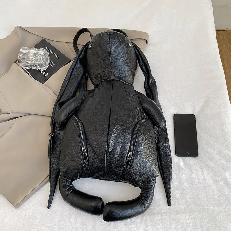 Black PU women's bucket backpack with double straps, patchwork stitching and internal phone, ID and hidden pockets