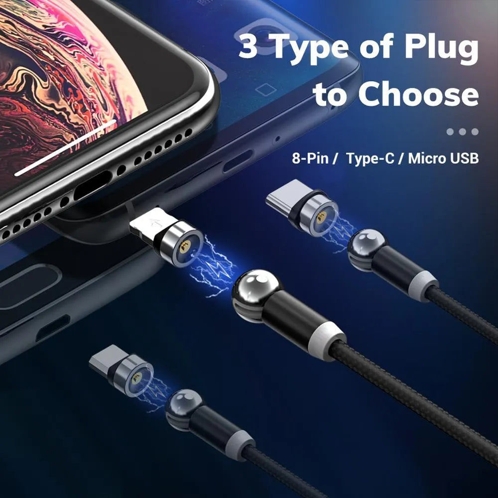 Black magnetic charging cable with spherical rotating connector next to a mobile phone.