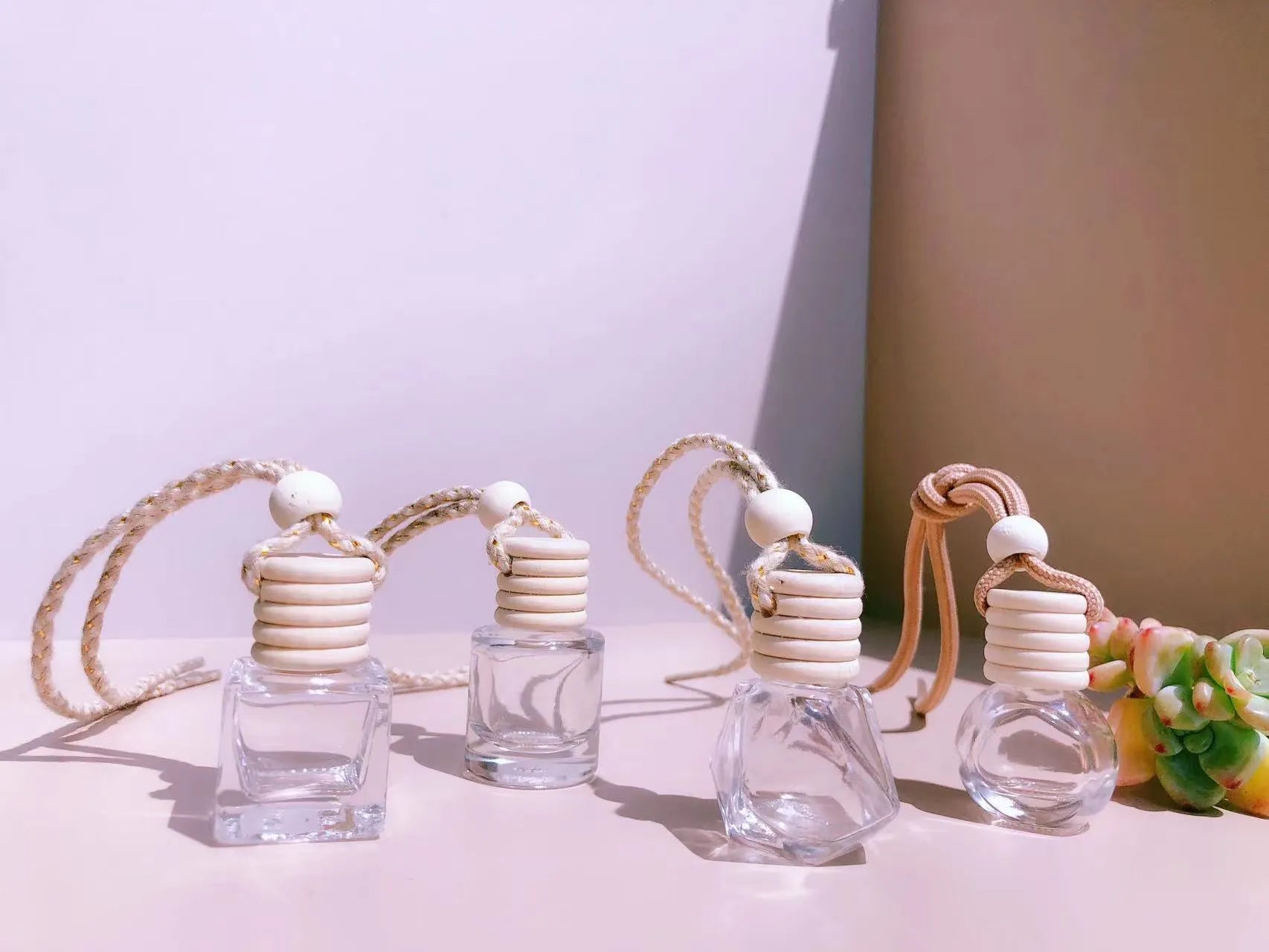 Glass car fragrance pendant showing Cylinder, Diamond, Flat Drum, and Square bottle style options.