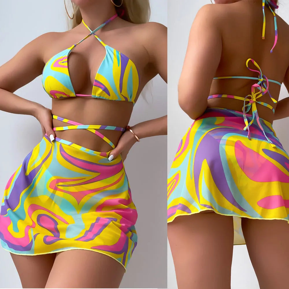 Yellow striped women's halter swimsuit with lace-up front, worn with matching skirt and shorts.