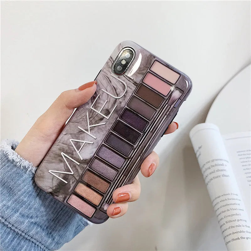 Flesh coloured silicone iPhone case with an eye shadow pattern design on the back.