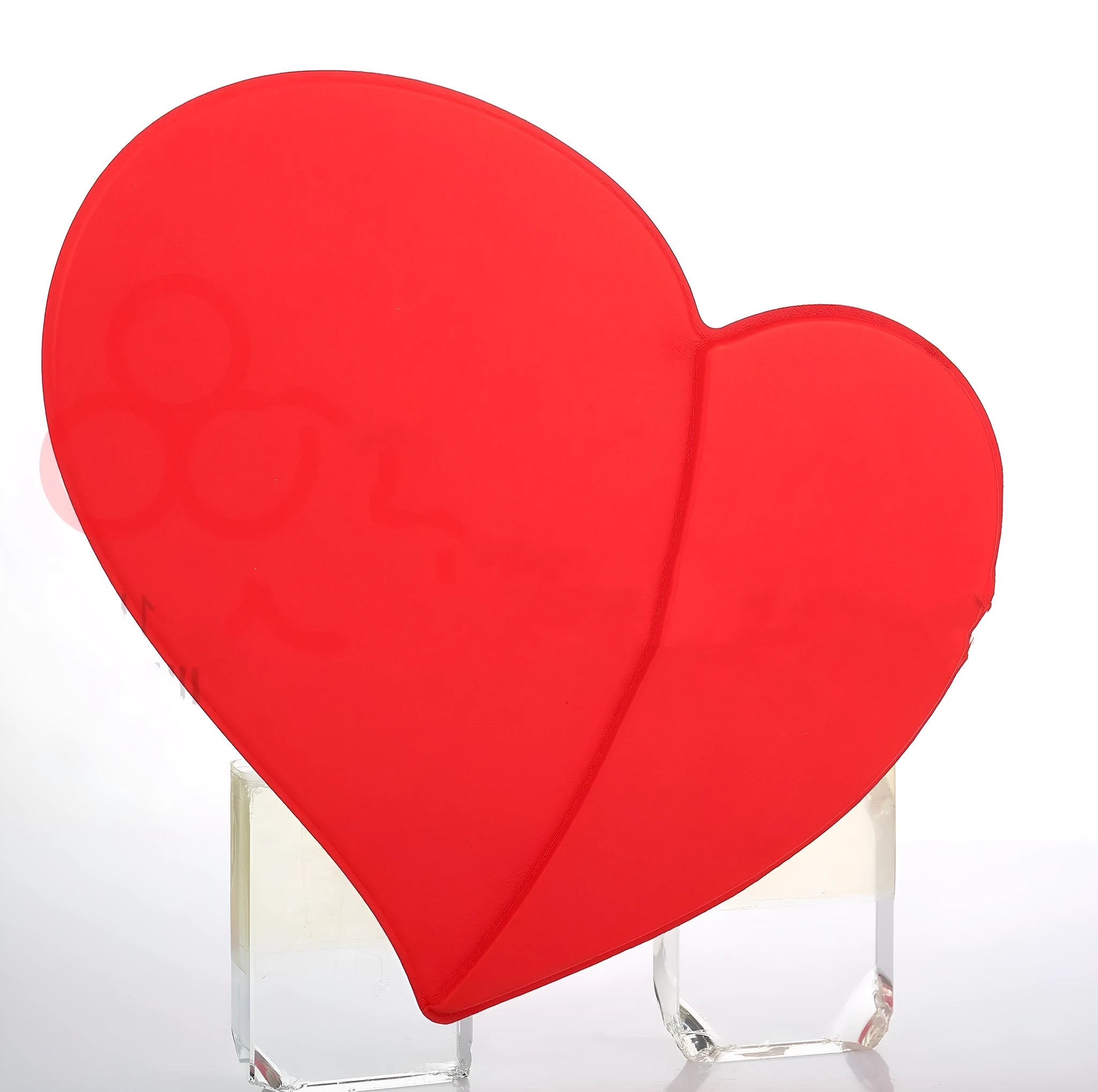 Heart shaped red leather wireless charging mouse pad with indicator light on a desk