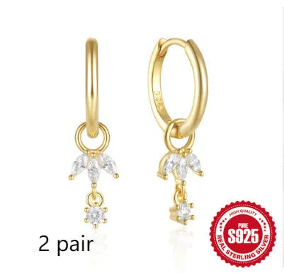A pair of geometric sunflower design earrings in sterling silver with golden zircon stones.