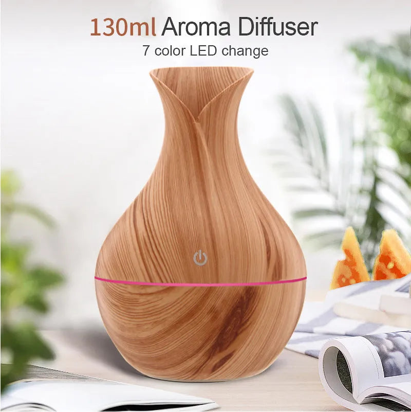 Small vase humidifier with 130ml water tank in Crackle Mahogany finish, USB powered, on a wooden desk