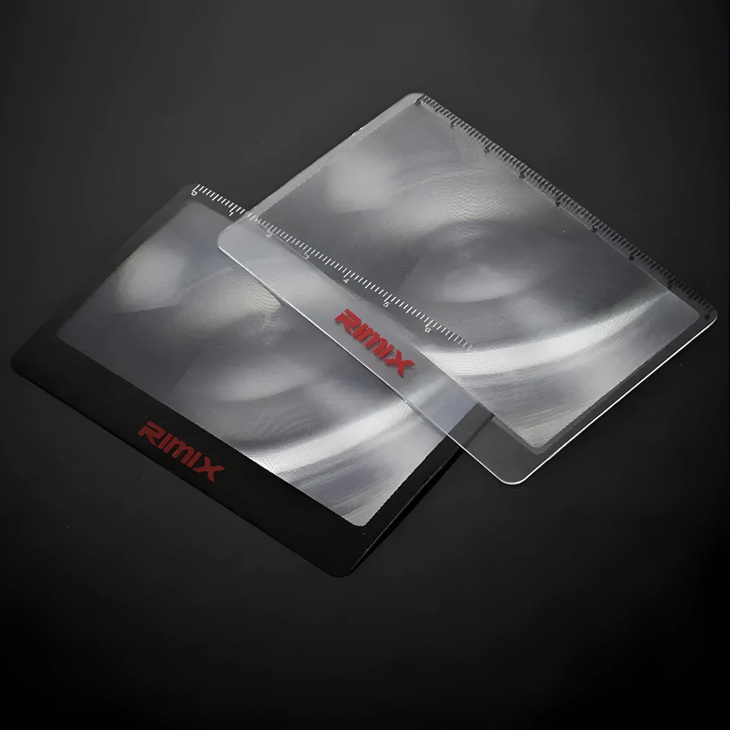 Portable credit card sized plastic magnifier in Black and White colour options.