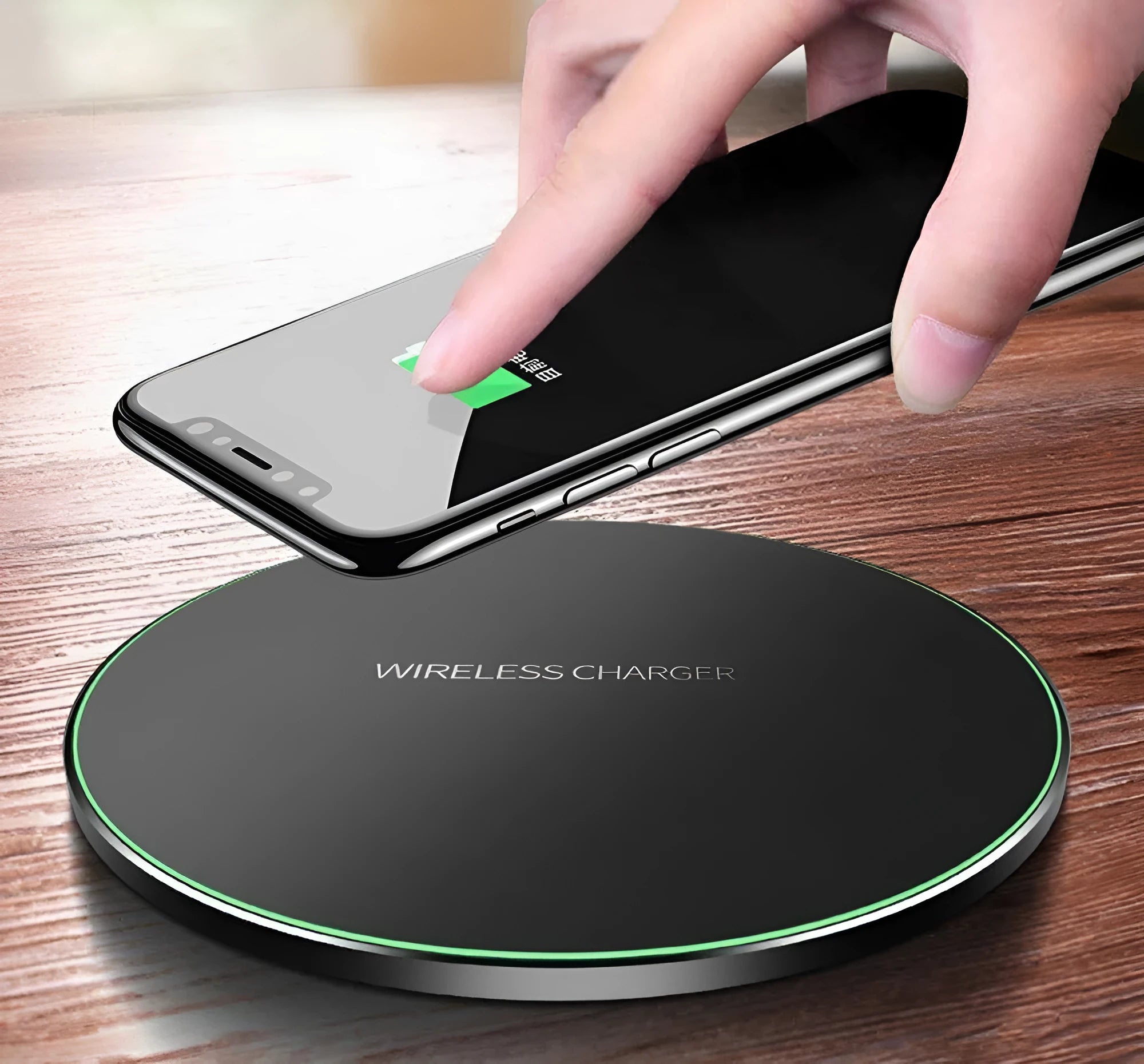 Ultra-thin black aluminium QI wireless charger with USB cable on wooden surface