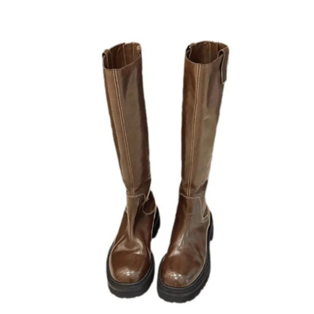 Women's black knee-high round toe boots with a chunky heel and back zipper on a white background.