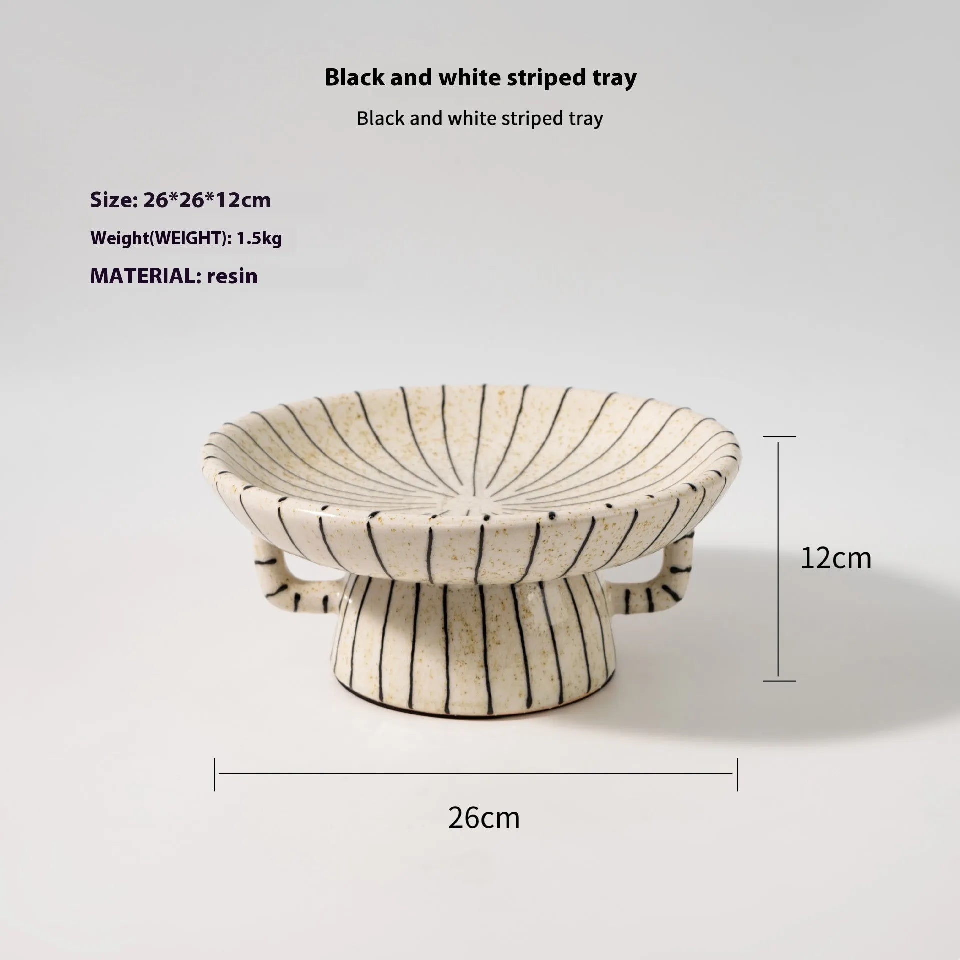 Black and white striped synthetic resin fruit plate on a table