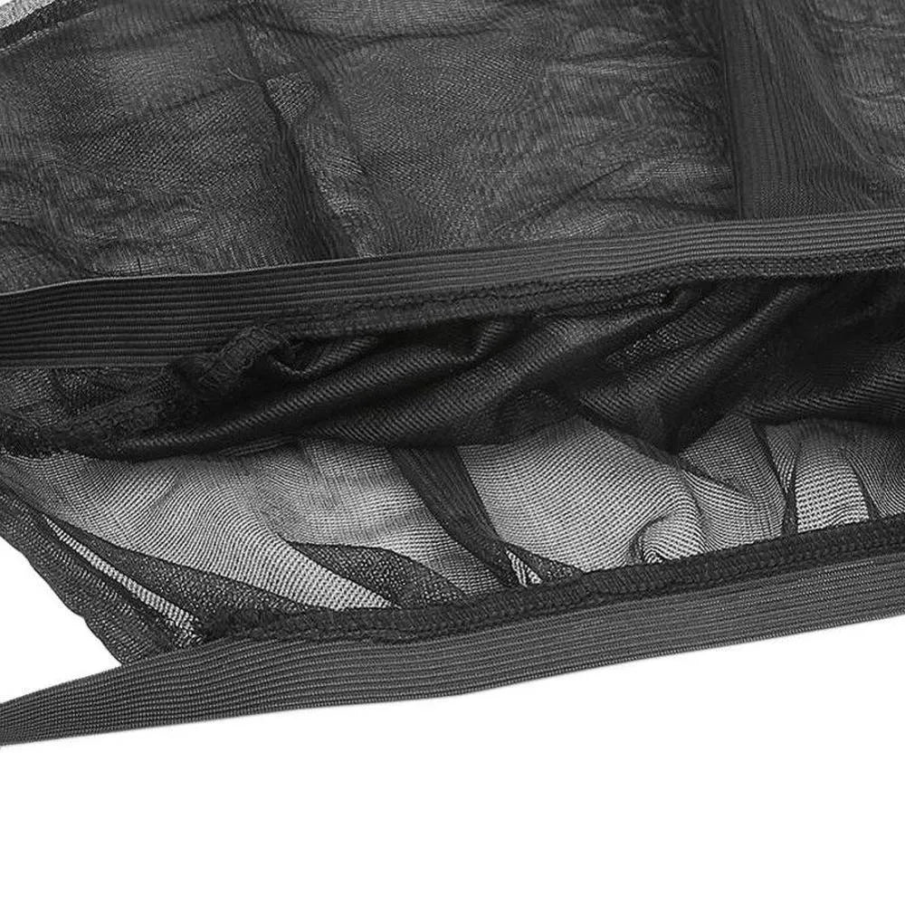 Set of 4 black mesh car window sunshade covers 50x40cm on car window showing breathable fabric UV protection