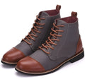 Men's black leather motorcycle boots with metal buckle straps on a thick rubber sole.