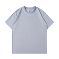 A man and woman modelling a loose-fit, solid colour pure cotton short sleeve T-shirt.