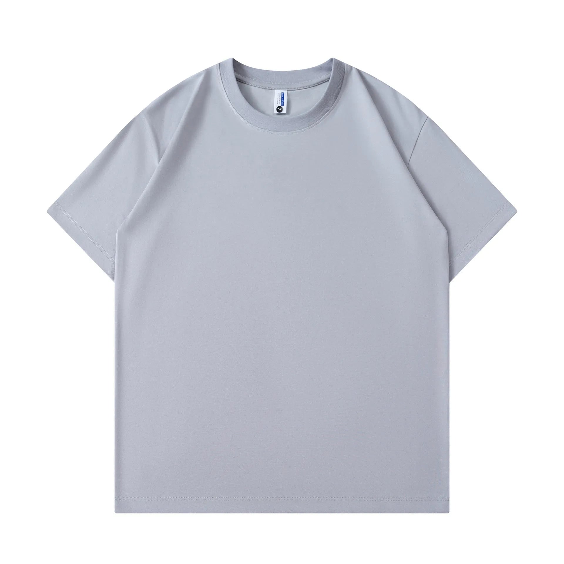 A man and woman modelling a loose-fit, solid colour pure cotton short sleeve T-shirt.