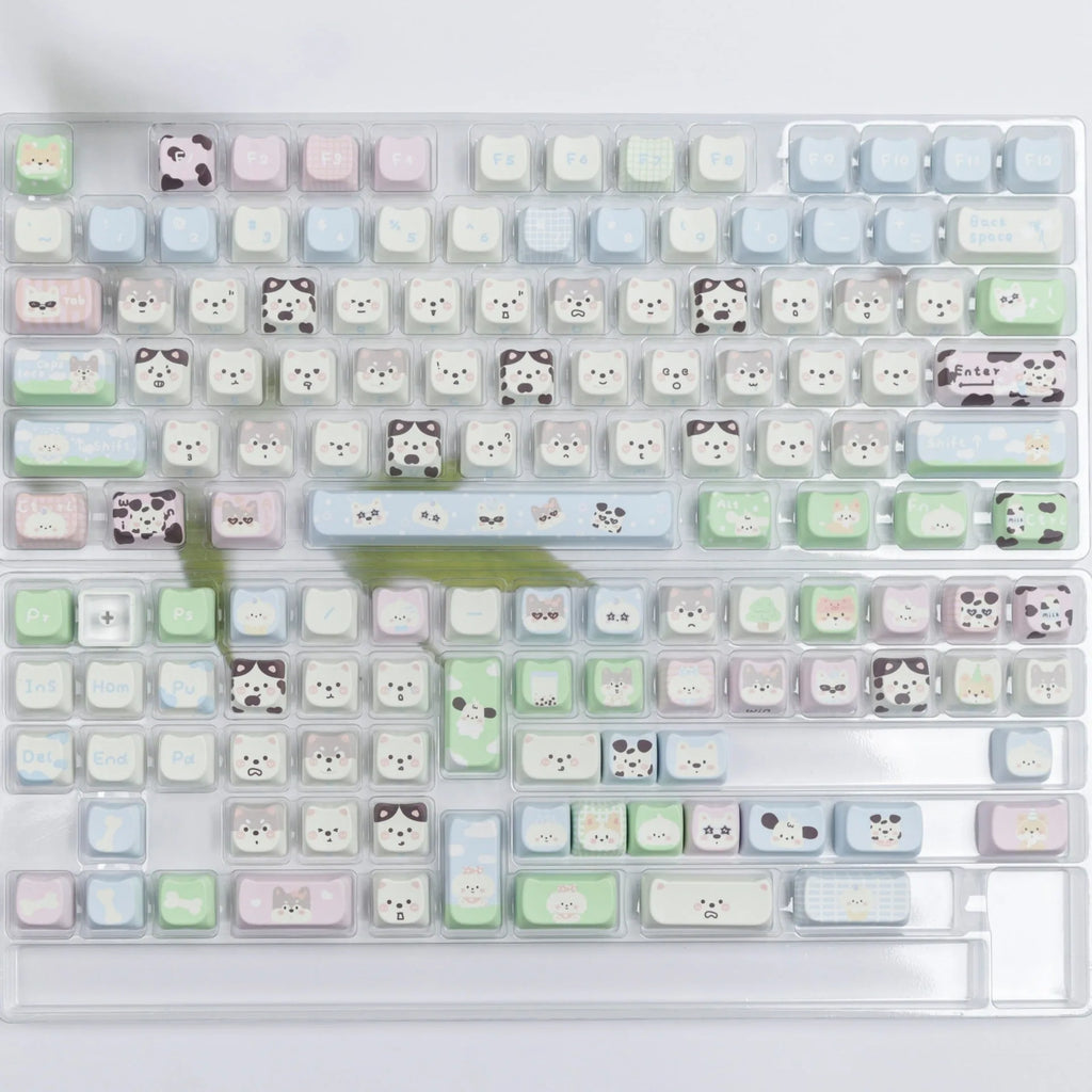 Colourful PBT key cap set for mechanical keyboards with printed cat and puppy designs.
