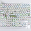 Colourful PBT key cap set for mechanical keyboards with printed cat and puppy designs.