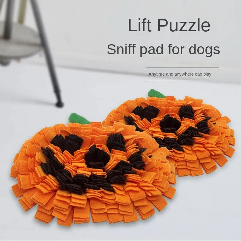 Orange pumpkin-shaped dog snuffle mat with textured surface for slow feeding and scent work training.