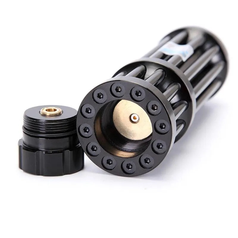 Black anodised aluminium laser flashlight with blue indicator and tail switch, shown next to an 18650 battery for scale.