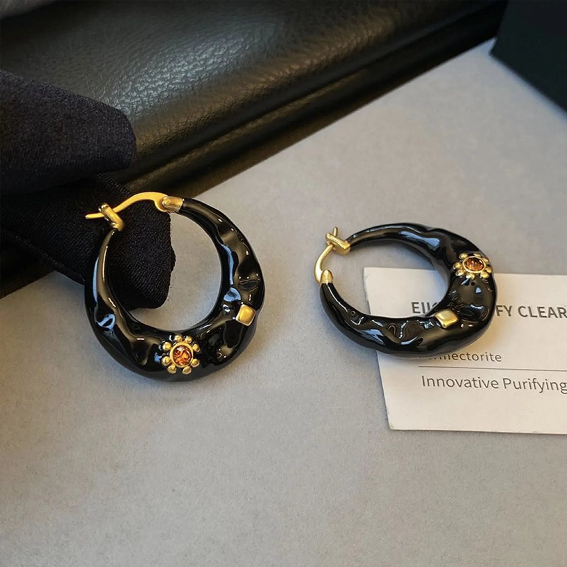 Hong Kong style retro ear studs with dripping oil texture and rhinestone decoration in black or red colour options