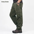 Men's wool-lined cotton velvet overalls in army green, shown in a loose straight-leg fit.