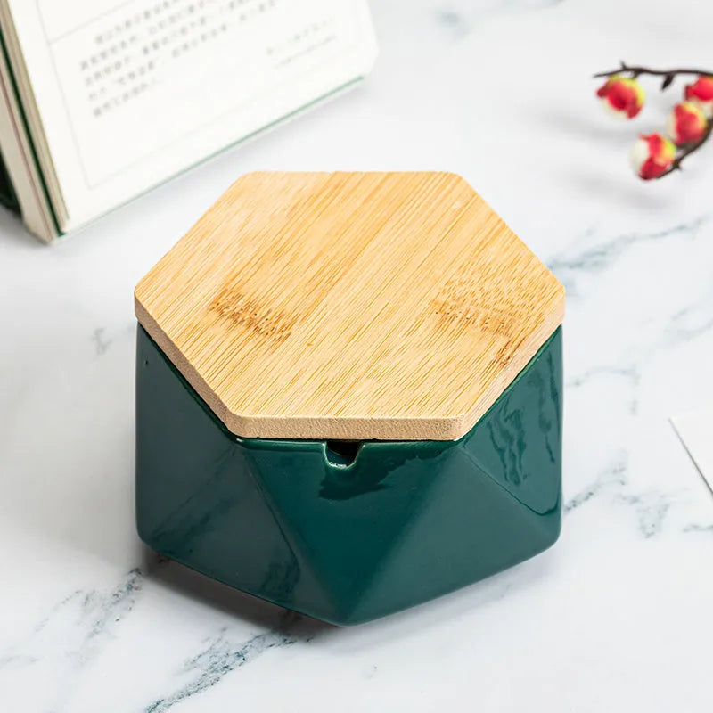 Ceramic ashtray with lid, Nordic style, available in multiple colours, on a tabletop