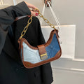 Brown denim women's shoulder bag with diamond mesh and chain detail, bucket shape.