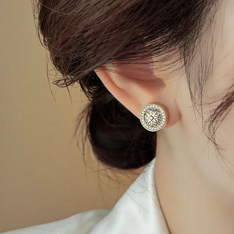 Pair of copper eight-pointed star stud earrings with real gold plating and inlaid zircon