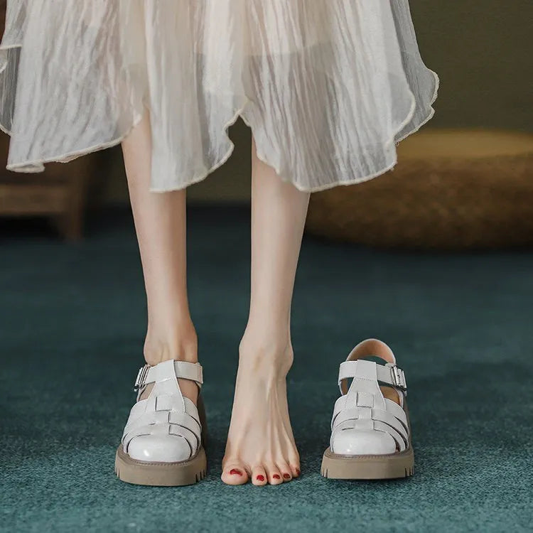 Women's retro closed-toe platform sandals with chunky heel and buckle strap in beige.