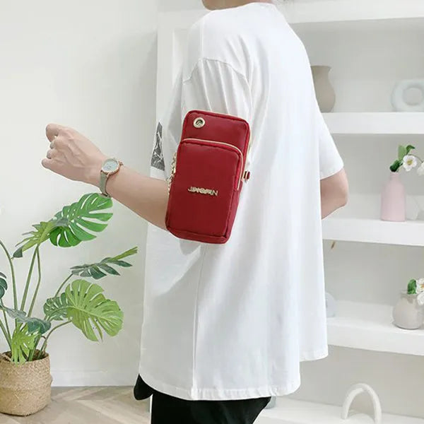 Nylon crossbody mobile phone bag with three zippered layers, card slots, and an adjustable strap in black