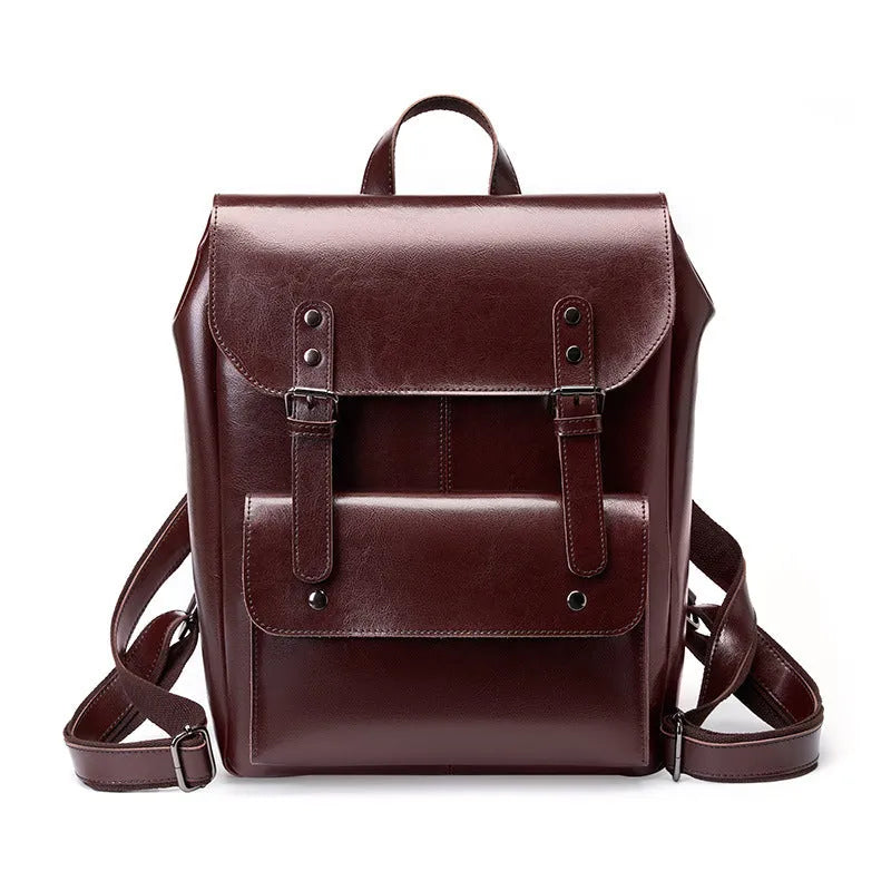 Black two-layer cowhide leather computer backpack for women with internal lining.