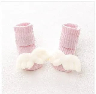 Cotton baby floor socks in assorted colours and prints like blue bow and pink stars on a size chart.