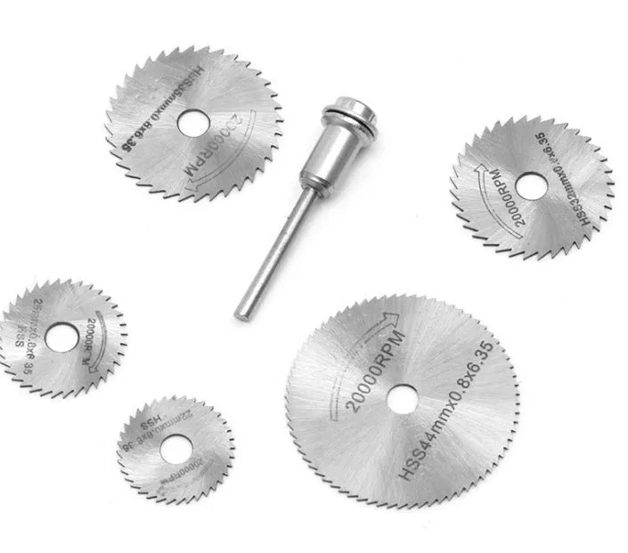 Set of six high-speed steel circular saw blades and a mandrel on a white background