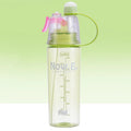 Green portable sports mist spray cup with transparent body, volume scale, handle, and spray mouth.