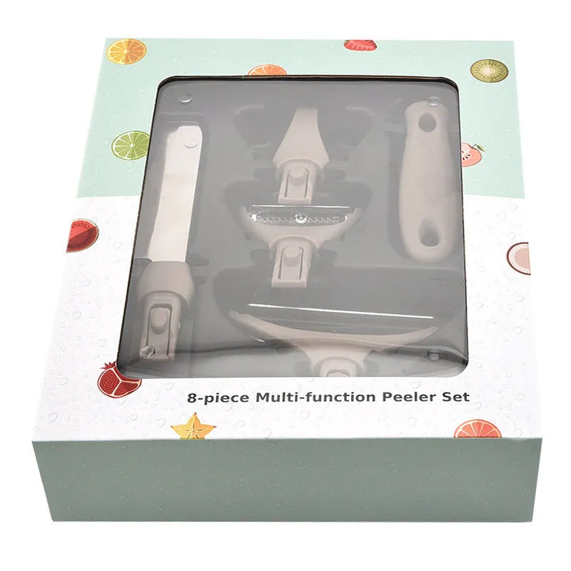 Green eight-piece stainless steel kitchen cutter set with peeler, knife, and integrated chopping board.