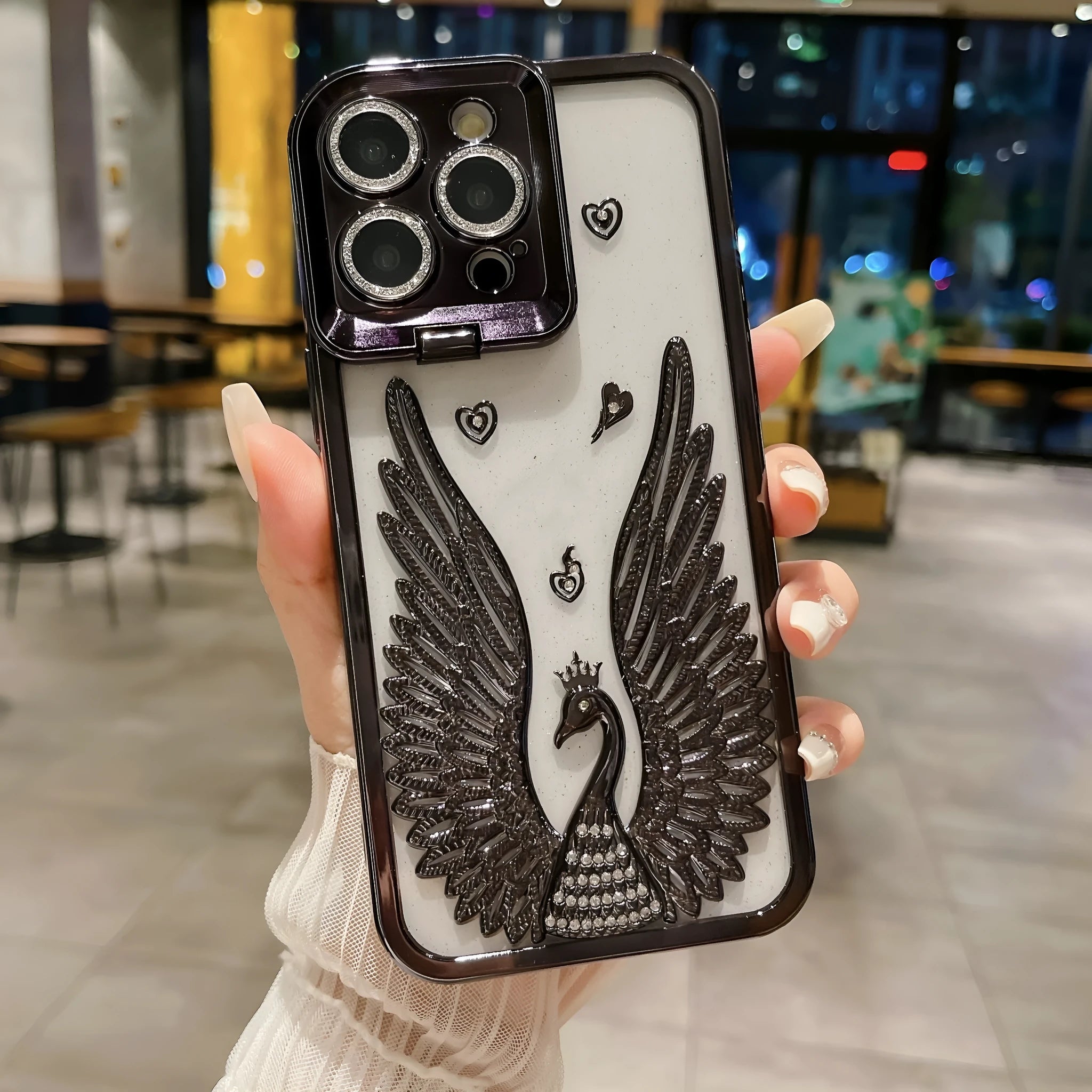 Angel wing frame bracket electroplated TPU phone case in transparent black for iPhone 15 Pro Max with built-in stand