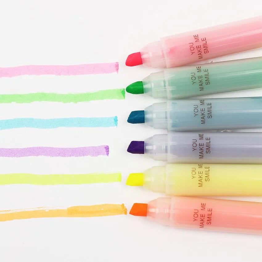 Set of six oblique highlighter pens with plastic shells in assorted colours, presented in a bag.