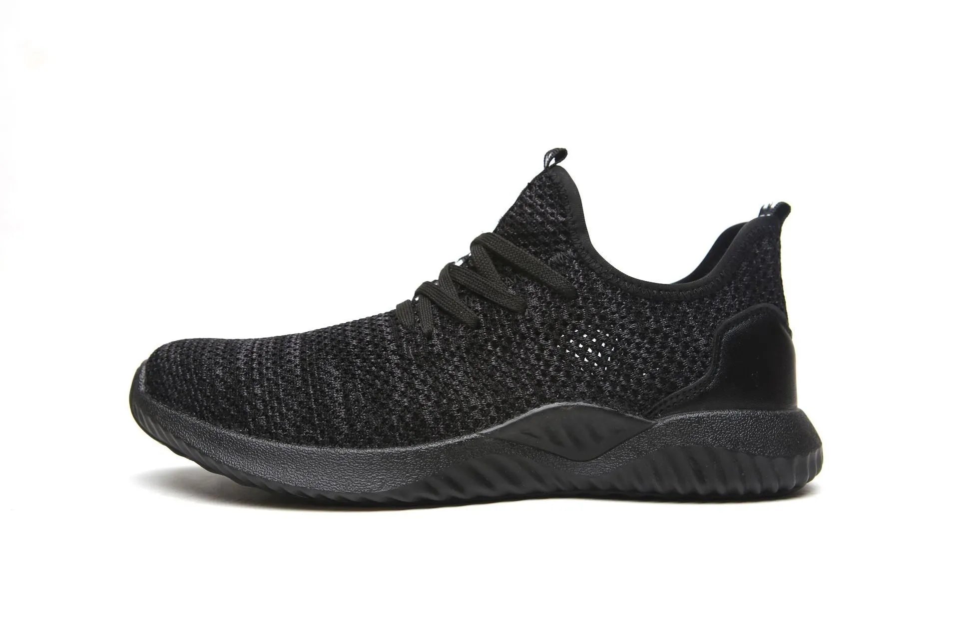 Black low-cut safety work shoe with a steel toe cap on a grey background.