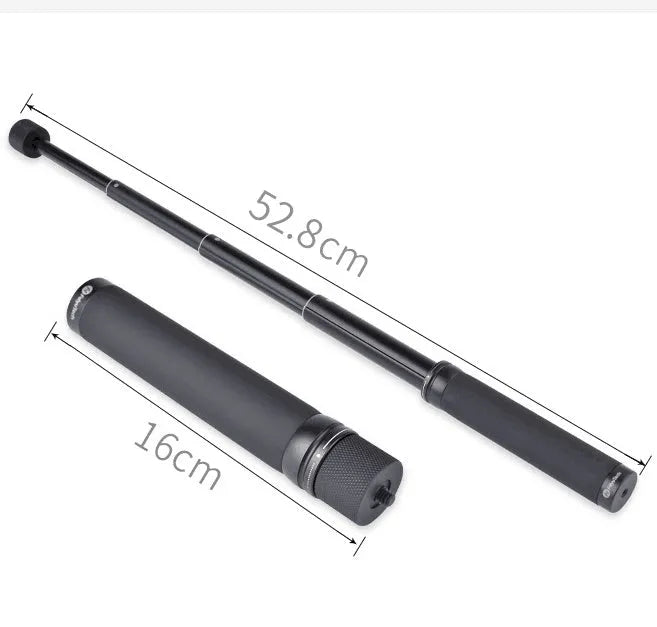 Black retractable aluminium selfie stick with phone clamp attached, shown extended and with a tripod mounted on its base.