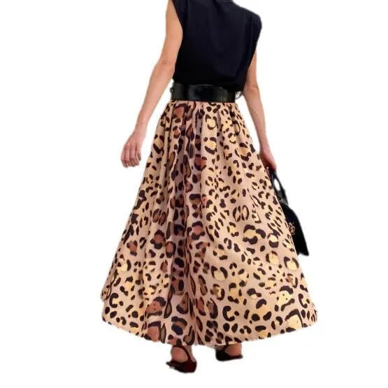 Brown leopard print women's long A-line skirt with a deep hem, shown on a hanger.