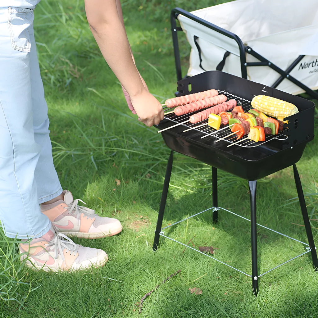 Portable metal barbecue oven with black grill rack, 29x12x44cm, for camping and outdoor use, serving 3-5 people.