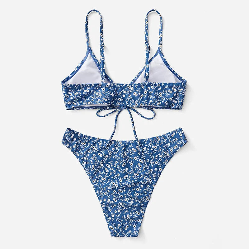 Blue polyester swimsuit three-piece set showing top and shorts for swimming.
