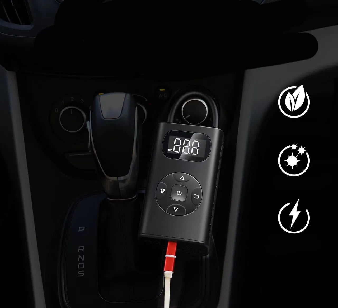 Black portable USB car tyre inflator power bank with hose on a grey background